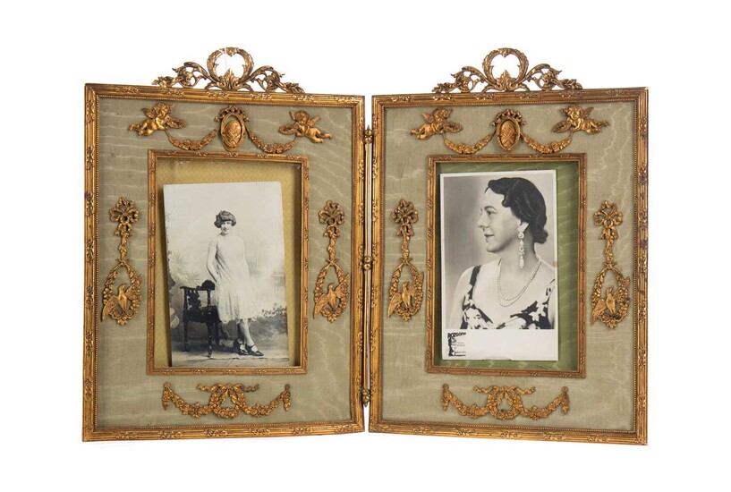AN EARLY 20TH CENTURY ORMOLU DOUBLE PICTURE FRAME