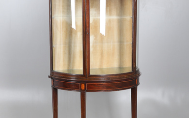 AN EDWARDIAN MAHOGANY AND INLAID BOW FRONTED DISPLAY CABINET.