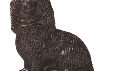 AN ENGLISH BROWN-GLAZED STONEWARE MODEL OF A SEATED SPANIEL, 19TH CENTURY