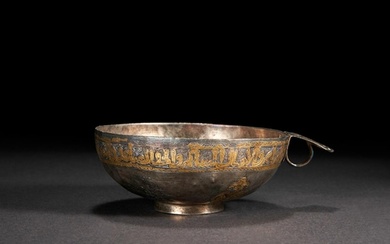 AN IMPORTANT INSCRIBED PARCEL-GILT SILVER SOGDIAN SADDLE CUP...
