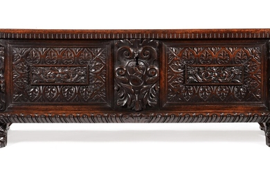 AN ITALIAN CARVED WALNUT CASSONE, LATE 17TH/EARLY 18TH CENTURY
