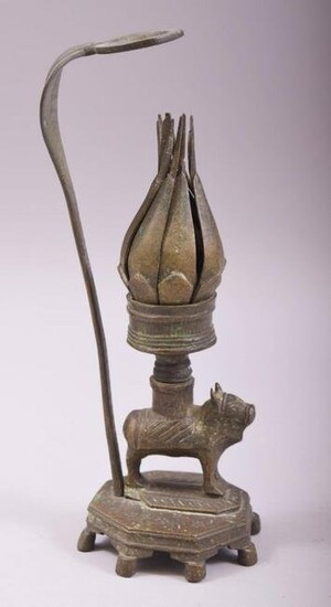 AN UNUSUAL INDIAN BRONZE CANDLESTICK, with reticulated