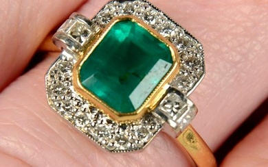 An 18ct gold emerald and vari-cut diamond dress ring.Emerald calculated weight 1.41cts, based on