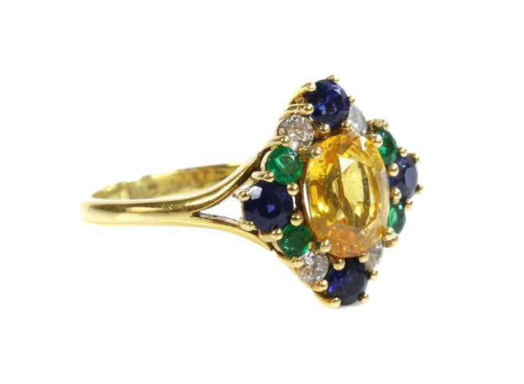 An 18ct gold, yellow sapphire, blue sapphire, emerald and diamond cluster ring