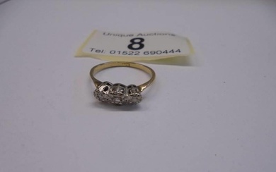 An 18ct yellow gold three stone diamond ring, size L, 2 gram...