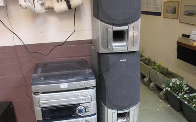 An AIWA stereo system together with a pair of matching...