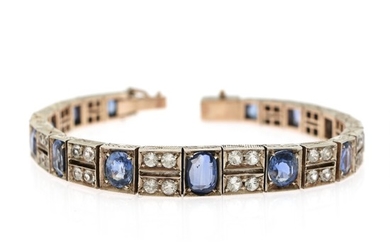 An Art deco sapphire bracelet set with numerous oval and circular-cut sapphires, mounted in silver. L. 19 cm. W. 1–1,5 cm.