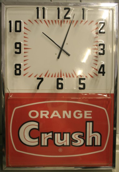 An Orange Crush illuminated advertising clock