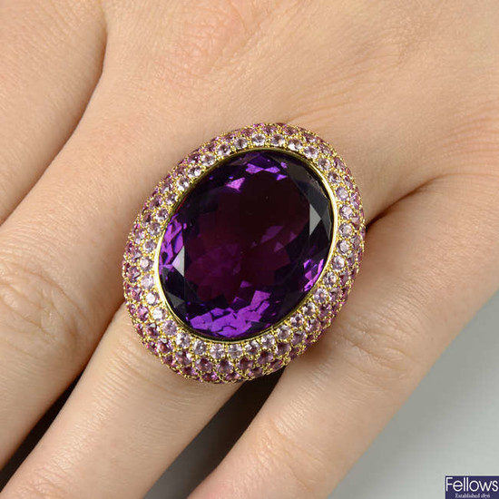 An amethyst and graduated pink sapphire dress ring.