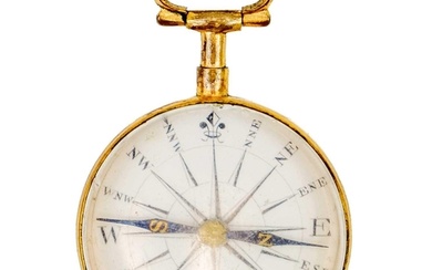 An early 19th century gilt brass compass with enamel dial an...