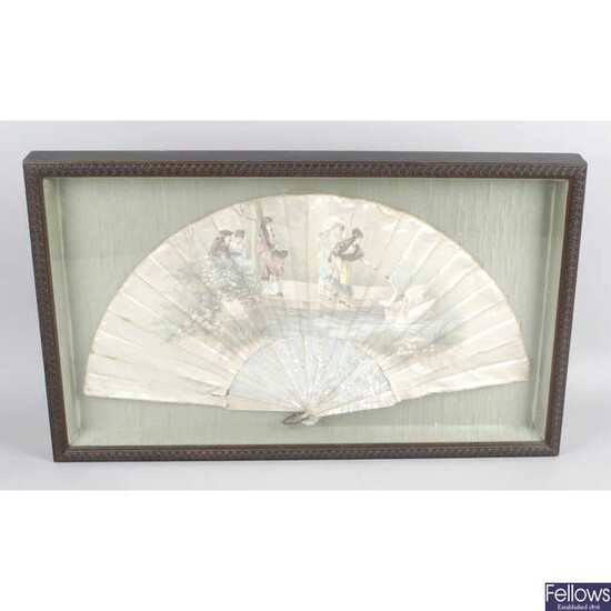 An early 20th century ladies hand held folding silk & mother-of-pearl fan