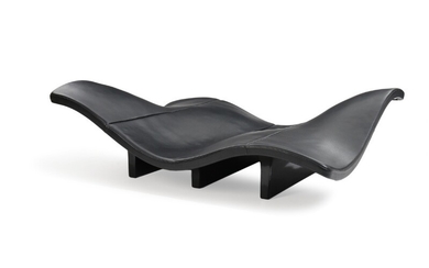 Anne-Mette Jensen & Morten Ernst: “Waves”. Large, sculptural chaise longue with frame of black lacquered fibre glass, upholstered with black leather.
