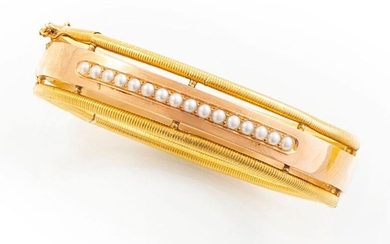 BRACELET in 18K yellow and pink gold retaining a line...