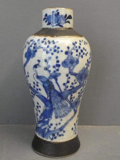 Blue and White crackle glaze vase decorated with a peacock i...