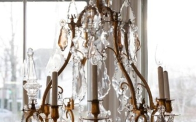 Baccarat Style Crystal and Bronze Eight Light Chandelier.