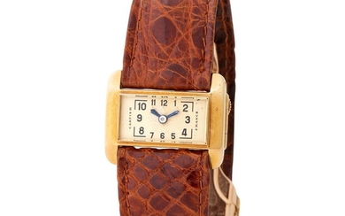 Cartier France. Very Rare and Unusual Driver Wristwatch in Yellow Gold, With Black Arabic Numerals Dial
