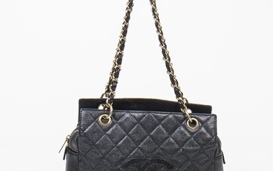 NOT SOLD. Chanel: A "Tote" bag of black Caviar leathet with gold toned hardware, two...