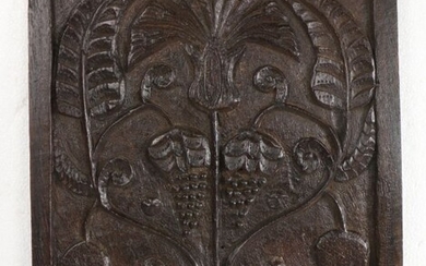 Charles II carved oak panel, Lancashire, with two bunches of grapes to the centre and a flower and