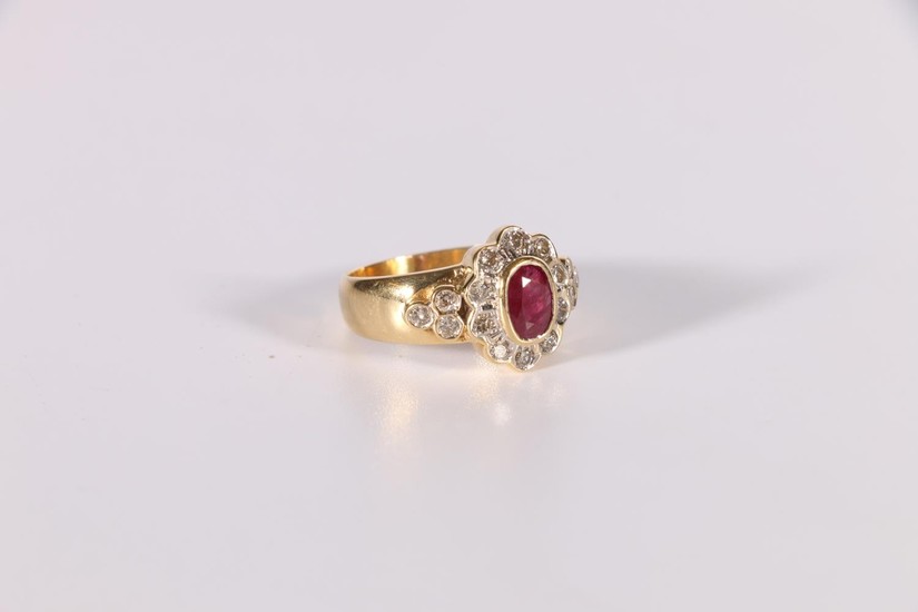 Cluster ring with an oval ruby and ten diamond brilliants, d...
