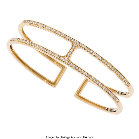 Diamond, Gold Bracelet The hinged cuff features full-cut diamonds...