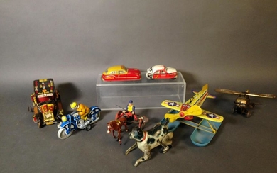 Eight Assorted Tin Litho Wind Up Toys