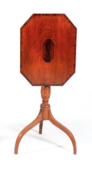 FEDERAL TILT-TOP CANDLESTAND In mahogany. Rectangular cut-corner top with conforming figured wood inlaid panel at center and figured...