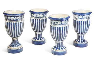 Four blue and white glazed ceramic garden urns