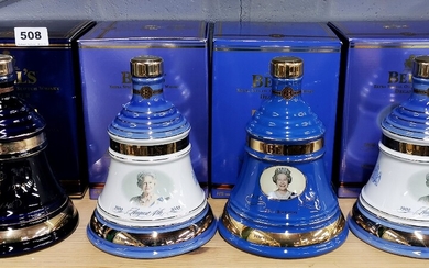 Four unopened Bell's commemorative whiskey decanters.