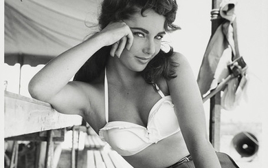Frank Worth (American, b.1923-d.2000): A black and white photographic print of Elizabeth Taylor, 1956