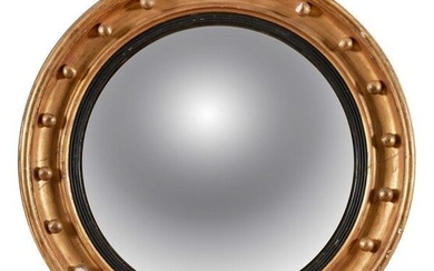 GRAND MIROIR SORCIERE circulaire dans un cadre en bois doré à décor de vingt boules....