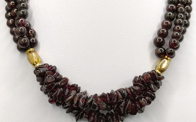 Garnet necklace, three strands, two gold plated elements in the middle, hook clasp, length 38cm