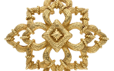 Gold Brooch The 18k gold brooch weighs 37.28 grams....