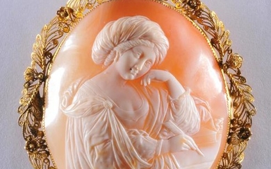 Large carved shell cameo brooch. 18k yellow gold frame