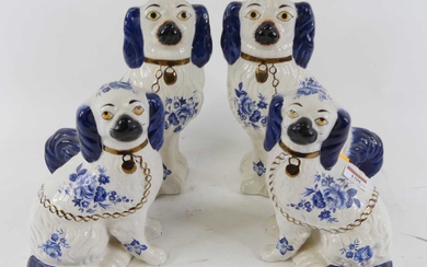 Lot details A pair of Staffordshire seated spaniels of typical...