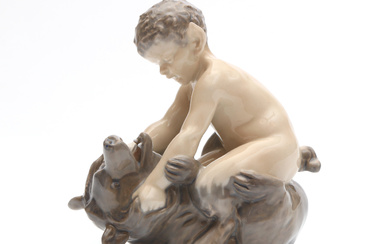 ROYAL COPENHAGEN. Figurine. Porcelain. No 648. Faun grappling with bear.