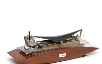 Reugen 144-Note Music Box. Boat shaped musix box with a mahogany base,...