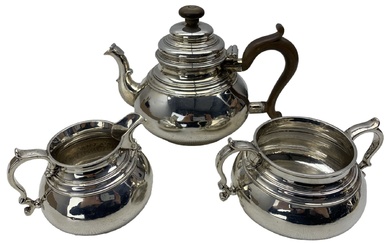 Silver three piece tea set of compressed circular form