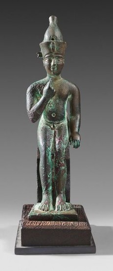 Statuette of seated Harpocrates Horus wearing the crown...