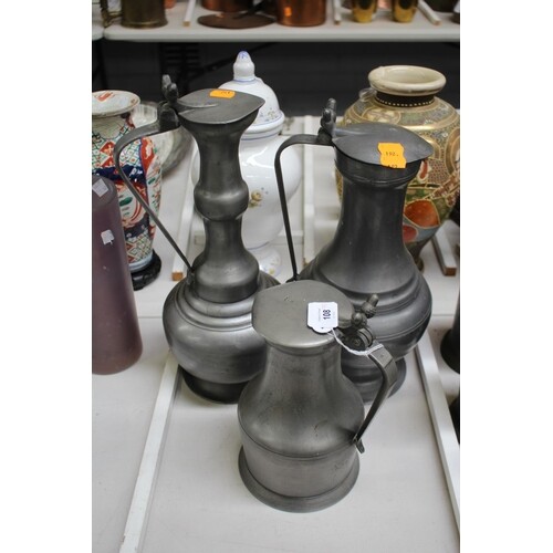 Three large pewter ewers, approx 41cm H and shorter (3)