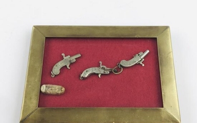 Three miniature Austrian pistols