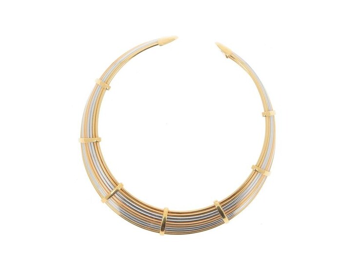 * Torque-type choker made of ten separate 18k (750 mils) yellow and white gold wires held by yellow gold loops and ending with two rounded and screwed bites. Nice flexibility.
