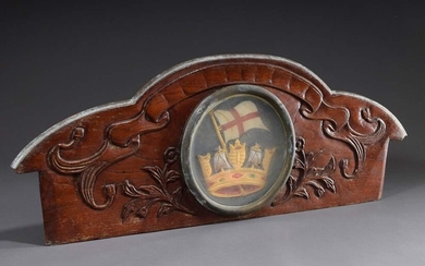 Transom of a small coastal sailing vessel, mahogany with relief carving with coloured tondo under glass "Flag of the Kingdom of England and Crown", end of 18th c., 34x94cm, defective