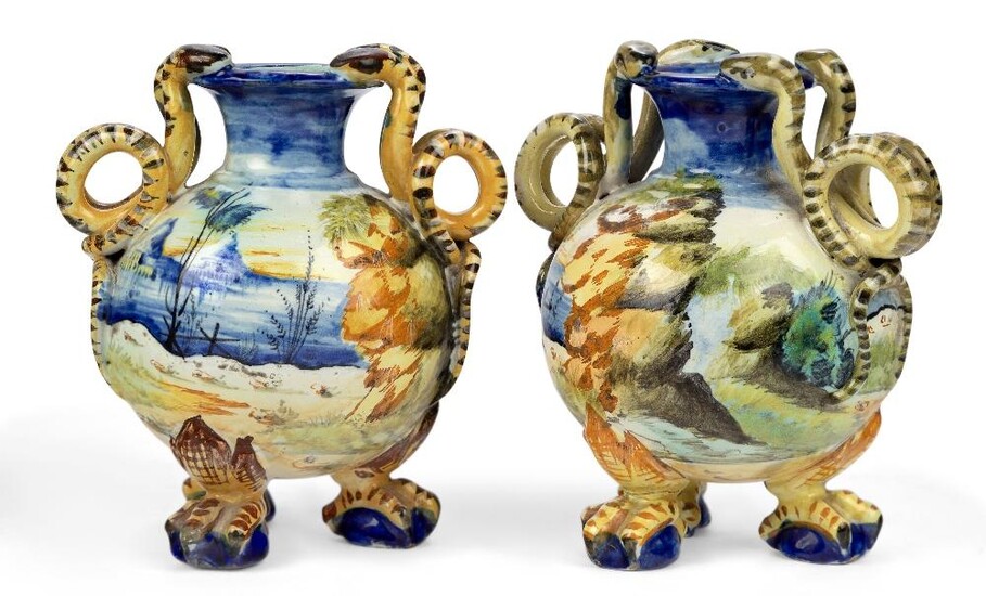 Two Florence maiolica small two-handled vases, late 19th century, manganese cockerel marks for the Cantagali workshop, manganese A mark to one and 31 (?) to the other, each of globular form on three paw feet, with waisted necks and scrolling snake...