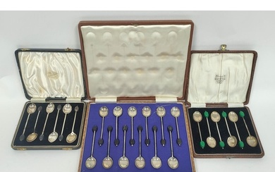 Two sets of six silver coffee spoons with bean ends and anot...