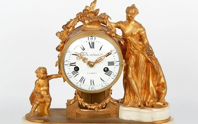 White marble and gilded bronze clock whose white...