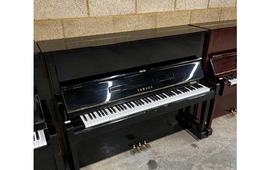 Yamaha (c1977) A Model U1 upright piano in a traditional bri...