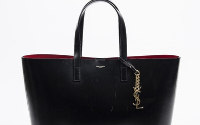 Yves Saint Laurent: An "East West shopper" bag of black leather, leather trimmings, gold tone hardware and two handles. – Bruun Rasmussen Auctioneers of Fine Art