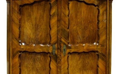 A Continental walnut armoire