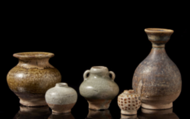 Five monochrome vessels in glazed earthenware (h.max 13 cm.)