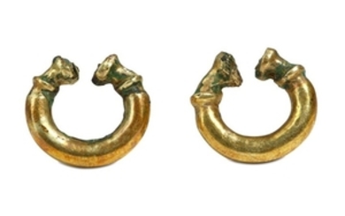 A PAIR OF WESTERN ASIATIC GOLD ON BRONZE EARRINGS